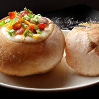 Thick ‘n Creamy Loaded Potato Soup - perfect for that cool Fall day or the middle of winter! Tender potatoes nestled in a creamy, cheesy soup with bacon, scallions and more cheese. #soup #breadbowl #cheesesoup #potatosoup #loadedbakedpotato #bakedpotato