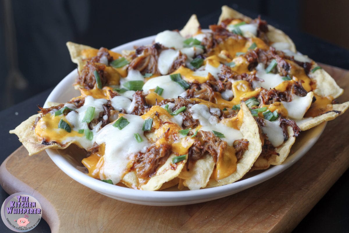 Happy New Year! These @lilliesqchicago pulled pork loaded nachos