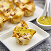 These crispy baked wonton shells are stuffed with cheesy corned beef & sauerkraut filling making them the perfect St. Patrick's day appetizer! Cheesy Reuben Wontons, wonton cups, baked wontons, leftover corned beef, St. Patrick's day appetizers, crispy baked wontons, cheesy Reubens