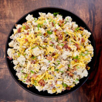 Transform chicken, crispy bacon, cheddar cheese, and cooked pasta coated in a homemade ranch dressing into the most amazing pasta salad! Ultimate Bacon Chicken Ranch Pasta Salad easy pasta salad, rotisserie chicken salad, bbq chicken pasta salad, cookout foods, leftover salads, hot and cold salads