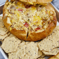 The perfect game-day dish! Grilled Italian crumbled meatballs, zesty pepperoni, & cheese stuffed in a bread bowl then smoked to cheesy perfection! The Best Smoked Cheesy Meatball Pepperoni Bread Bowl, grilled meatballs, cheesy bread bowl, football foods, game day appetizers, stuffed bread, big green egg smoked bread