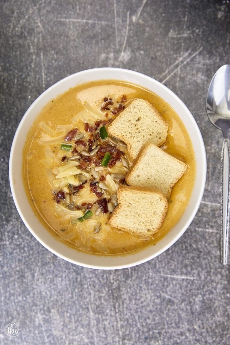 Smoked butternut squash with jalapenos, crispy bacon, cheese & white beans makes this the perfect creamy cold-weather soup! Ultimate Creamy Smoked Butternut Squash White Bean Bacon Soup, smoked winter squash, creamy butternut squash soup, northern bean soup, winter soups, yoder smokers soups