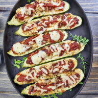 Looking for a mouthwatering and crave-worthy meal that is both gluten-free and keto-friendly without sacrificing flavor? Get ready to indulge in a dish that's bursting with cheesy Italian flavors, easy to make, and delicious! Easy Sheet Pan Smoked Italian Sausage Ricotta Zucchini Boats, gluten-free recipes, keto-friendly dinner recipe, stuffed zucchini, yoder smokers pizza oven, meal prep recipes, easy italian zucchini