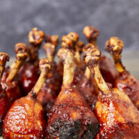 Chicken Lollipops are a delicious, flavorful, and fun-to-eat twist on classic grilled chicken! Fire up the grill today and elevate your BBQ game with flame-kissed bbq chicken lollipops. Fire up the Flavor with Grilled BBQ Chicken Lollipops, chicken drumsticks, bbq chicken drumsticks, chicken lollipops, yoder smoker chicken, grilled chicken