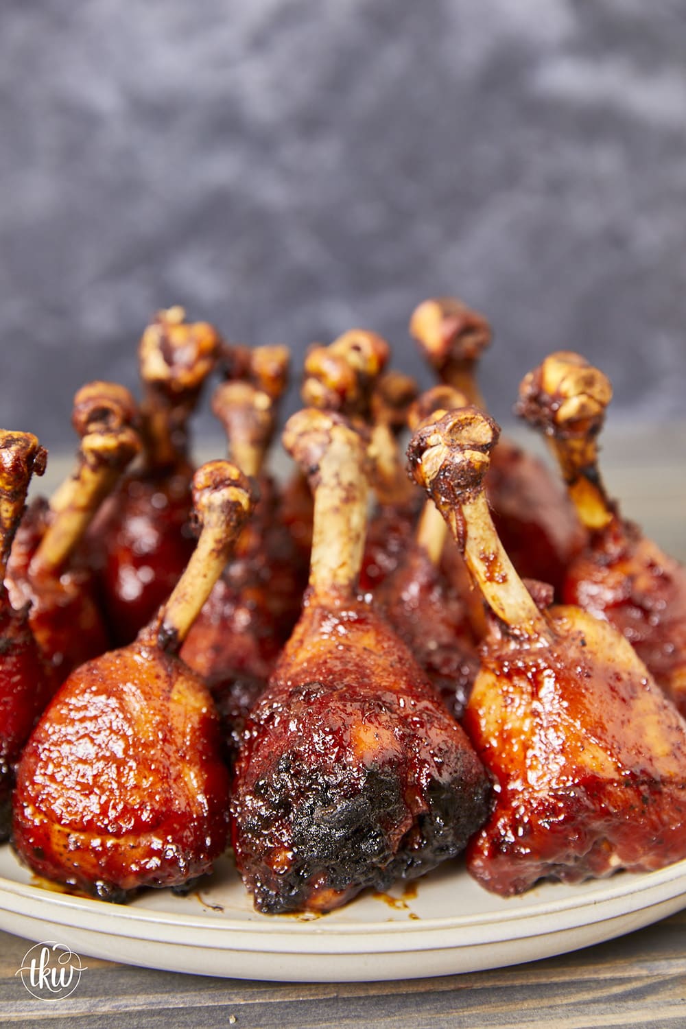 Chicken Lollipops are a delicious, flavorful, and fun-to-eat twist on classic grilled chicken! Fire up the grill today and elevate your BBQ game with flame-kissed bbq chicken lollipops. Fire up the Flavor with Grilled BBQ Chicken Lollipops, chicken drumsticks, bbq chicken drumsticks, chicken lollipops, yoder smoker chicken, grilled chicken