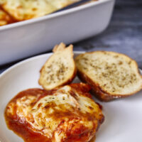 Super tender chicken breasts coated in savory marinara, zesty Italian seasonings, and 2 types of cheeses make this perfect any night of the week. Plus the leftovers are incredible! One Pan Easy Cheesy Italian Mozzarella Baked Chicken, one dish chicken, mozzarella chicken, cheesy baked chicken, Italian baked chicken, marinara chicken bake