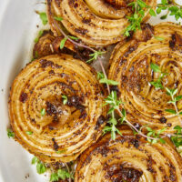 By smoking and caramelizing Vidalia onions, you're transforming a humble vegetable into a mouthwatering dish that will elevate any dish! From burgers to pizza, casseroles to dips, smoked caramelized onions add a savory culinary delight to any dish! Caramelized Sweet Vidalia Onions On The Smoker, smoked onions, smoked caramelized onions, yoder smoker smoked onions, onion dip, onion jam, burger toppings