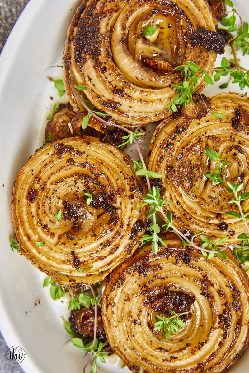 By smoking and caramelizing Vidalia onions, you're transforming a humble vegetable into a mouthwatering dish that will elevate any dish! From burgers to pizza, casseroles to dips, smoked caramelized onions add a savory culinary delight to any dish! Caramelized Sweet Vidalia Onions On The Smoker, smoked onions, smoked caramelized onions, yoder smoker smoked onions, onion dip, onion jam, burger toppings