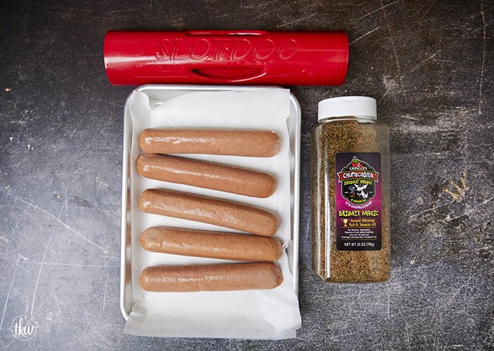 Are you looking to take your cookout game to the next level? Cross-hatching hotdogs, seasoning them with brisket seasoning, and smoking them make them one of the best hot dogs you'll ever have! The Best Smoked Hot Dogs You'll Ever Eat, cross-hatch cut hot dogs, yoder smoked hot dogs, grilled hot dogs, cook out foods, football food, game day eats