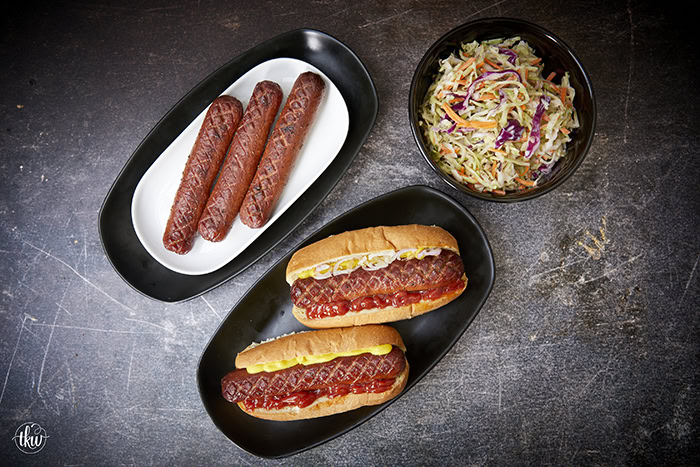 Are you looking to take your cookout game to the next level? Cross-hatching hotdogs, seasoning them with brisket seasoning, and smoking them make them one of the best hot dogs you'll ever have! The Best Smoked Hot Dogs You'll Ever Eat, cross-hatch cut hot dogs, yoder smoked hot dogs, grilled hot dogs, cook out foods, football food, game day eats