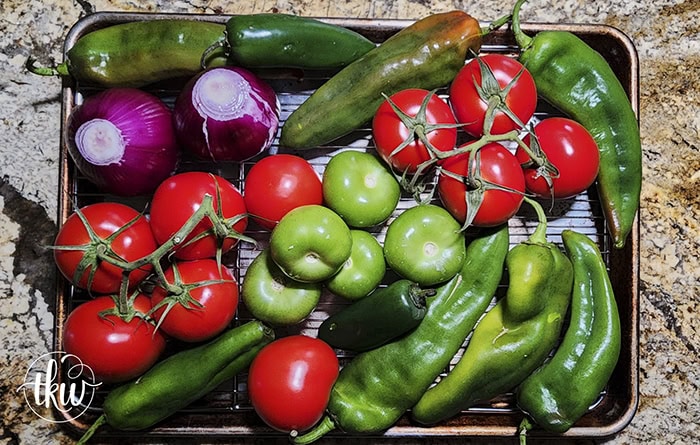 Smoking your vegetables is the secret ingredient you've been missing to elevate your salsa to something truly outstanding. Adding a smoky twist can transform your hatch chile salsa into a flavor fiesta like no other! The Best Smoked Hatch Chile Salsa, red hatch salsa, hatch chile season, smoked vegetables, chips and salsa, restaurant salsa, salsa fiesta, yoder smokers smoked salsa