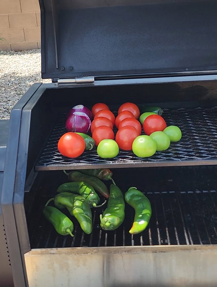 Smoking your vegetables is the secret ingredient you've been missing to elevate your salsa to something truly outstanding. Adding a smoky twist can transform your hatch chile salsa into a flavor fiesta like no other! The Best Smoked Hatch Chile Salsa, red hatch salsa, hatch chile season, smoked vegetables, chips and salsa, restaurant salsa, salsa fiesta, yoder smokers smoked salsa