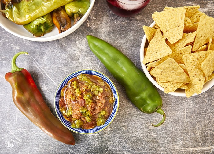 Smoking your vegetables is the secret ingredient you've been missing to elevate your salsa to something truly outstanding. Adding a smoky twist can transform your hatch chile salsa into a flavor fiesta like no other! The Best Smoked Hatch Chile Salsa, red hatch salsa, hatch chile season, smoked vegetables, chips and salsa, restaurant salsa, salsa fiesta, yoder smokers smoked salsa