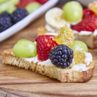 Honeycomb, whipped vanilla honey ricotta, and fresh fruits come together in a heavenly dessert crostini. This simple and sweet delight that will elevate any gathering or simply satisfy your sweet cravings. Simple Sweet Honeycomb Ricotta & Fresh Fruits Dessert Crostini, sweetened ricotta, ricotta spread, dessert ricotta, uses for leftover ricotta, bagel spread, crostini spread, cheesy dip, fruit dip, 3-ingredient ricotta dip