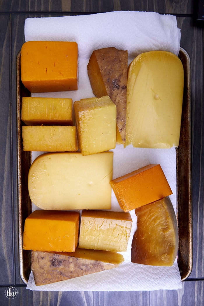 Smoked cheese is an amazing flavor boost to your charcuterie board, a sandwich, or any pasta dish. Learn how to cold smoke cheese at home!