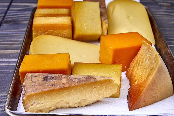 Smoked cheese is an amazing flavor boost to your charcuterie board, a sandwich, or any pasta dish. Learn how to cold smoke cheese at home!