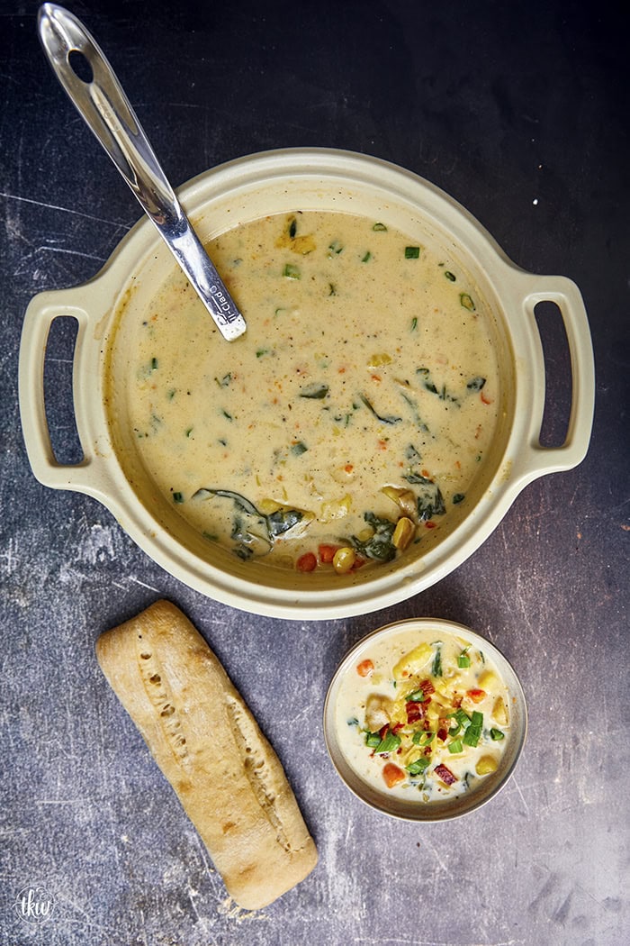 This one-pot creamy Boursin Potato Soup explodes with flavor. Finished with bacon, green onions, & cheese it's truly out of this world! Rich, velvety, and comforting, it’s the perfect dish for any occasion.