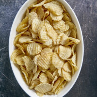 Elevate your boring potato chips by seasoning them with garlic & onion powder, coating them in Parmesan cheese & smoking them to perfection!