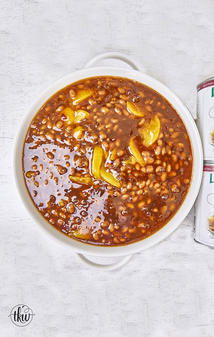 These Smoked Peach Pie Chipotle Baked Beans bring a bold, irresistible twist to a classic side dish. Slow-smoked beans soak up a rich, smoky sauce that combines the natural sweetness of peach filling with the smoky heat of chipotle peppers.