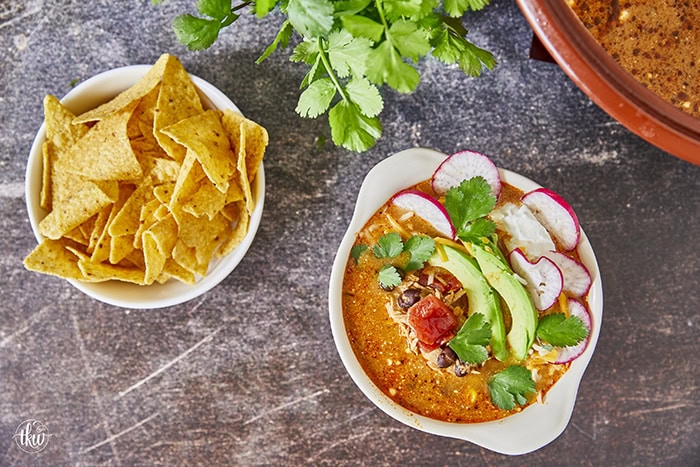 This Creamy Cheesy Chicken Enchilada Soup is the perfect blend of comfort and spice, made with simple pantry staples. Juicy shredded chicken, fire-roasted tomatoes, black beans, and peppers come together in a velvety broth infused with smoky Mexican spices. This soup delivers all the flavors of classic enchiladas in one easy, one-pot recipe.