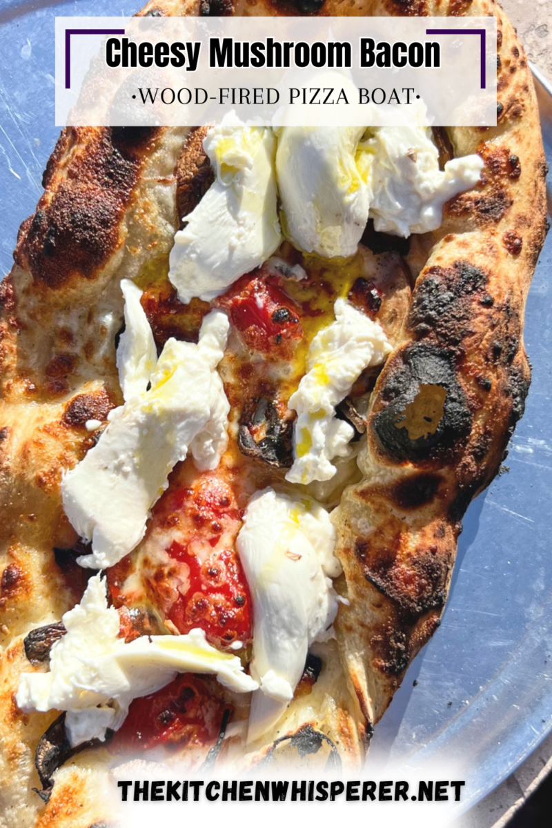 This wood-fired pizza, shaped like khachapuri, has a cheesy crust stuffed with cremini mushrooms, crispy bacon, and datterini tomatoes. It's then kissed with olive oil and finished with burrata, making it your new favorite pizza!